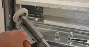 How To Get Garage Door Wheel Back On Track Fast