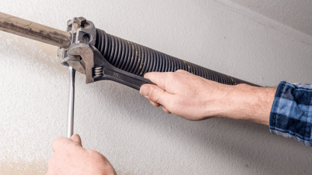 How To Adjust The Spring Tension On A Garage Door Safely