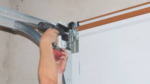 How To Get Wheel Back On Garage Door Track