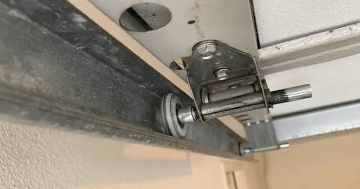 How Do I Put My Garage Door Back On Track