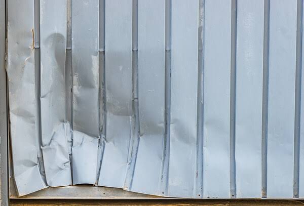 How To Fix A Dent In A Garage Door