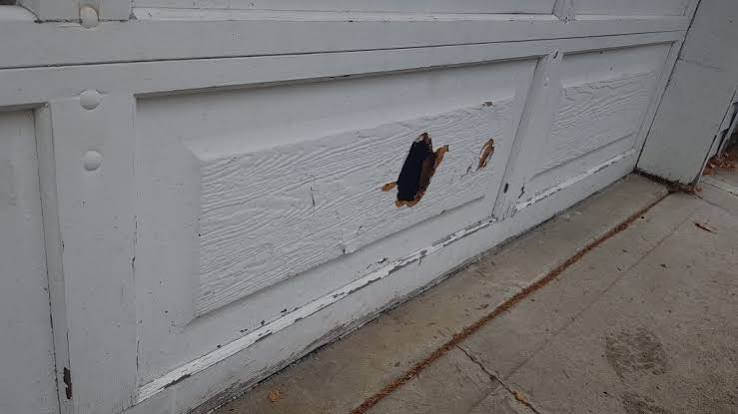How To Fix A Hole In A Garage Door Panel
