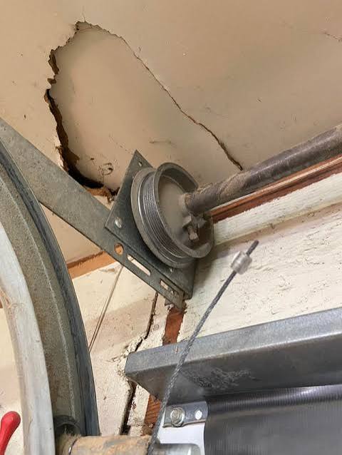 How To Get Garage Door Cable Back On Pulley