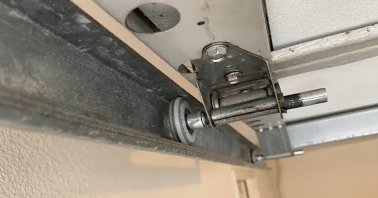 How To Put A Garage Door Roller Back On Track