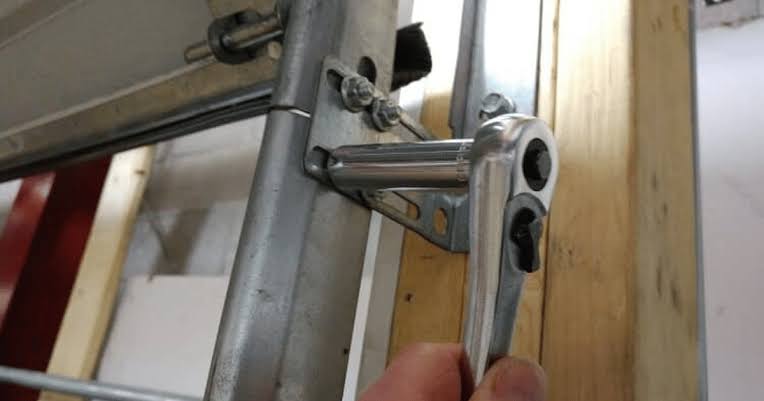 How To Put Garage Door Roller Back On Track